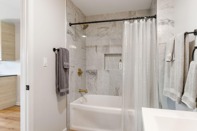 2060 S Algonquin Dr, Benton Harbor, MI 49022 - bathroom featuring shower / tub combo, vanity, and wood finished floors