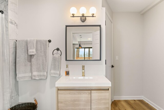 2060 S Algonquin Dr, Benton Harbor, MI 49022 - full bath with wood finished floors, vanity, and a shower with shower curtain