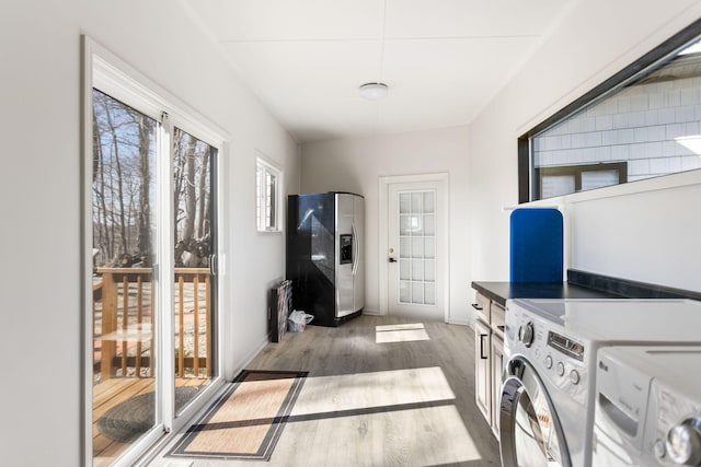 2060 S Algonquin Dr, Benton Harbor, MI 49022 - laundry area featuring washing machine and dryer and wood finished floors