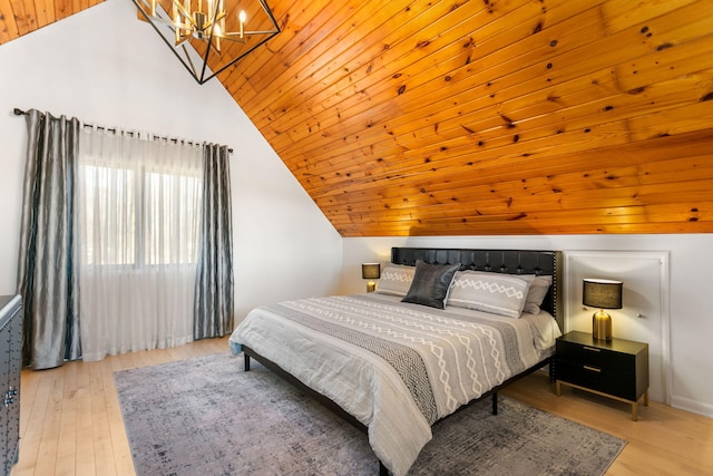 2060 S Algonquin Dr, Benton Harbor, MI 49022 - bedroom with a chandelier, vaulted ceiling, and wood finished floors
