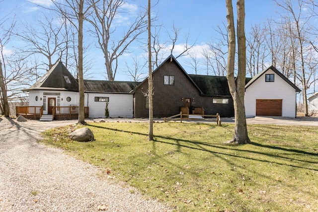 2060 S Algonquin Dr, Benton Harbor, MI 49022 - view of front of house with a wooden deck, asphalt driveway, a front yard, and a garage