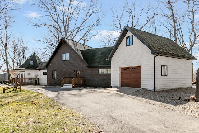 2060 S Algonquin Dr, Benton Harbor, MI 49022 - view of front facade featuring driveway, a garage, and a shingled roof