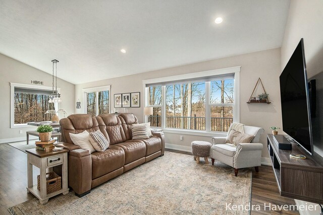 living room featuring recessed lighting, baseboards, lofted ceiling, and wood finished floors