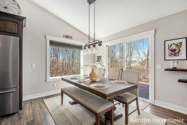 dining room featuring vaulted ceiling, baseboards, and dark wood-style flooring