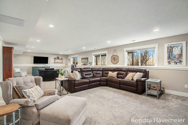 living area featuring recessed lighting, baseboards, and carpet