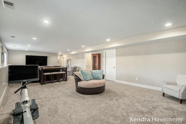 sitting room with recessed lighting, carpet, visible vents, and baseboards