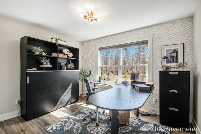 home office with baseboards and wood finished floors