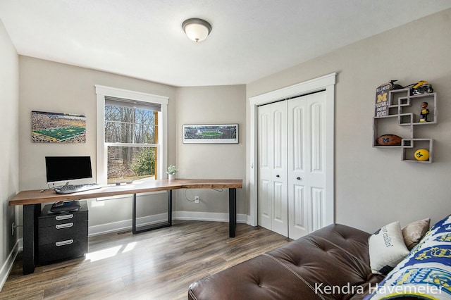 office area with wood finished floors and baseboards