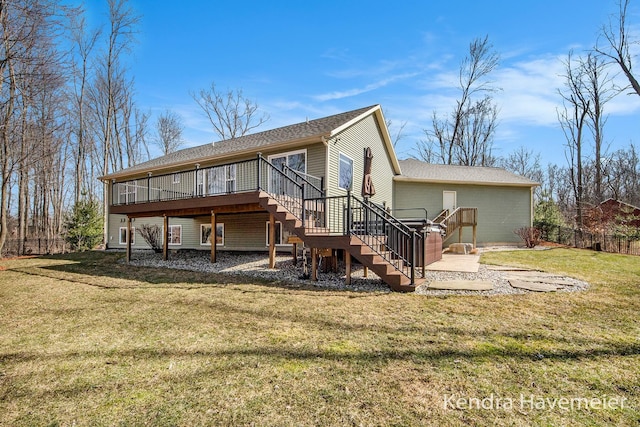 back of property with stairway, a lawn, a deck, and fence