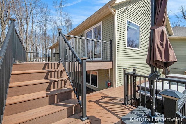 wooden terrace featuring stairs