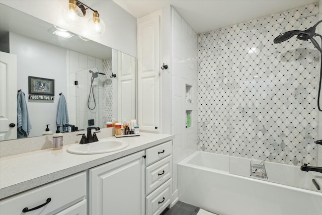 bathroom with tiled shower, vanity, and a washtub