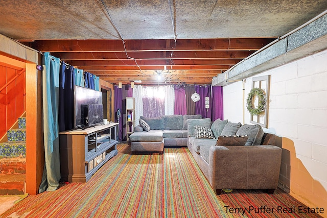 living room with concrete block wall