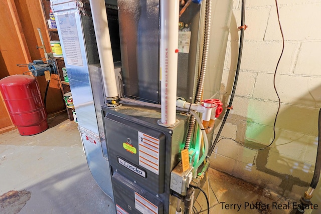 utility room with heating unit