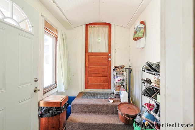 foyer entrance with lofted ceiling