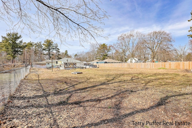 view of yard featuring fence