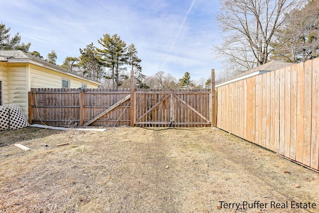 view of yard featuring a gate and fence