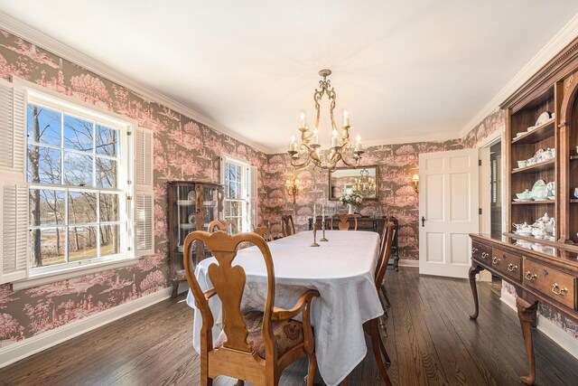 dining space featuring wallpapered walls, a notable chandelier, and dark wood-type flooring