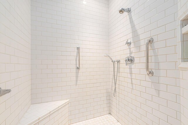 full bathroom with a tile shower