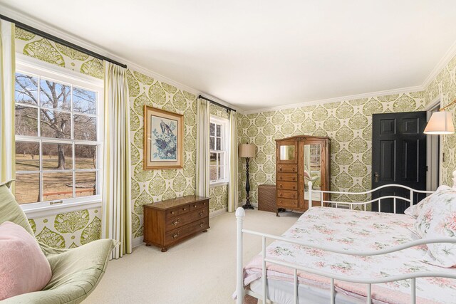 bedroom with carpet floors, ornamental molding, and wallpapered walls
