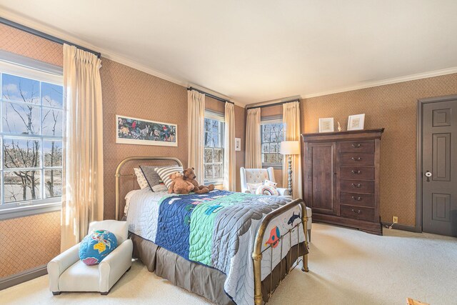 bedroom with carpet floors, wallpapered walls, and crown molding
