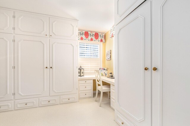 bedroom featuring light colored carpet