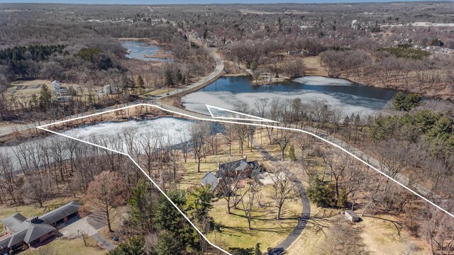 bird's eye view featuring a view of trees and a water view