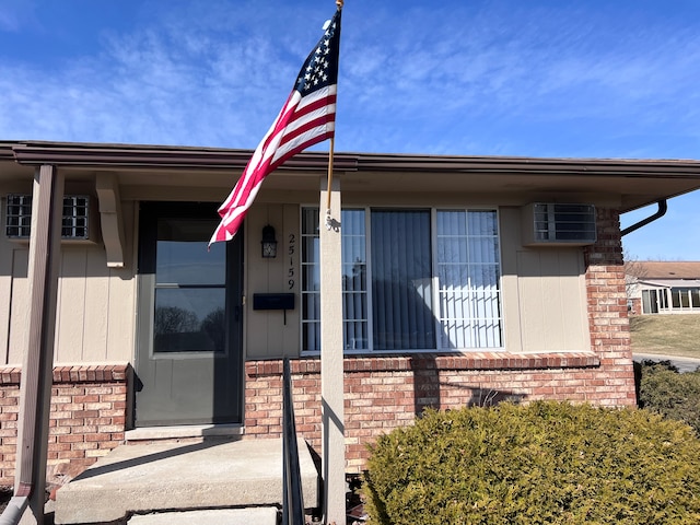 entrance to property with brick siding