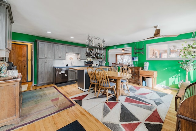 dining space with recessed lighting and light wood-type flooring