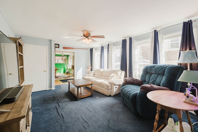 living room featuring carpet flooring and a ceiling fan