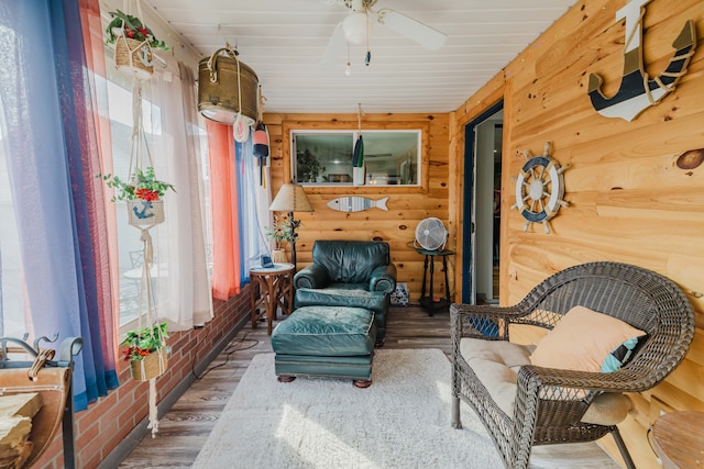 interior space with ceiling fan and wood finished floors