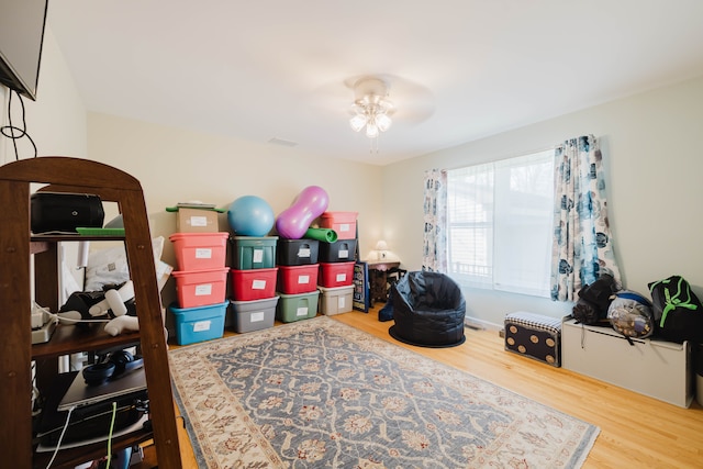 playroom featuring wood finished floors and a ceiling fan