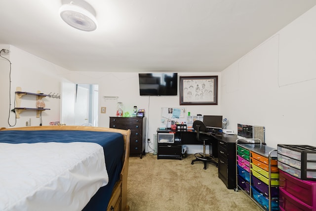 bedroom featuring light carpet