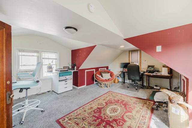 home office featuring lofted ceiling and carpet floors