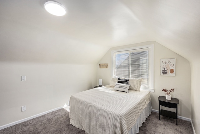 bedroom with baseboards, carpet, and vaulted ceiling