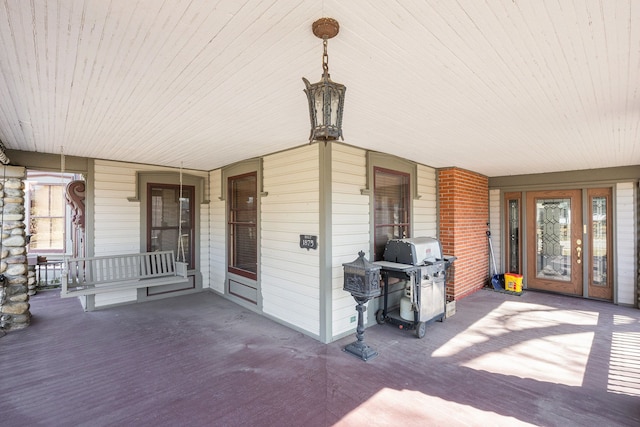 view of patio / terrace with covered porch and a grill