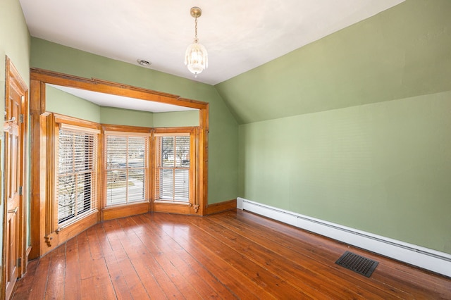 bonus room featuring hardwood / wood-style floors, visible vents, a baseboard radiator, an inviting chandelier, and vaulted ceiling