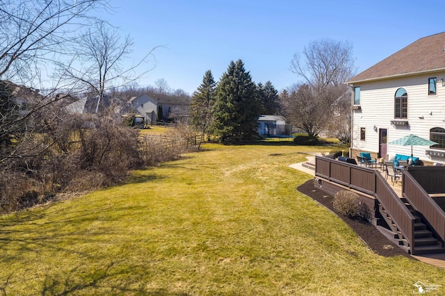 view of yard with stairway and a deck