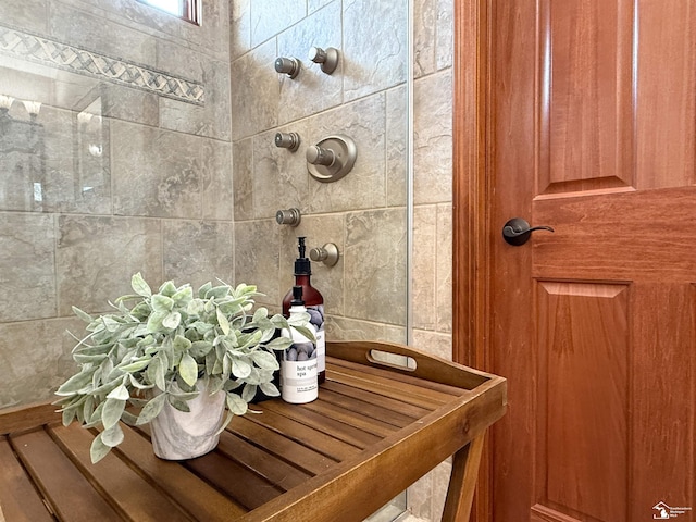 bathroom with a tile shower