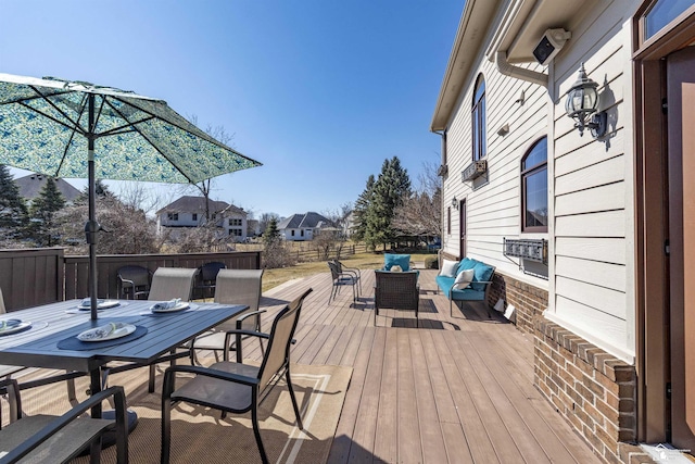 wooden deck with outdoor dining space