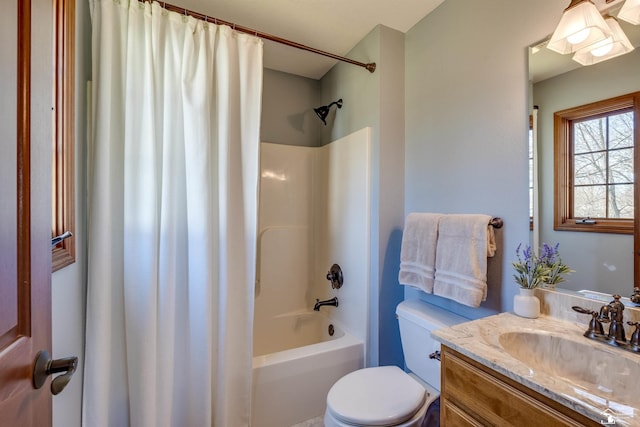 full bathroom featuring shower / tub combo with curtain, toilet, and vanity