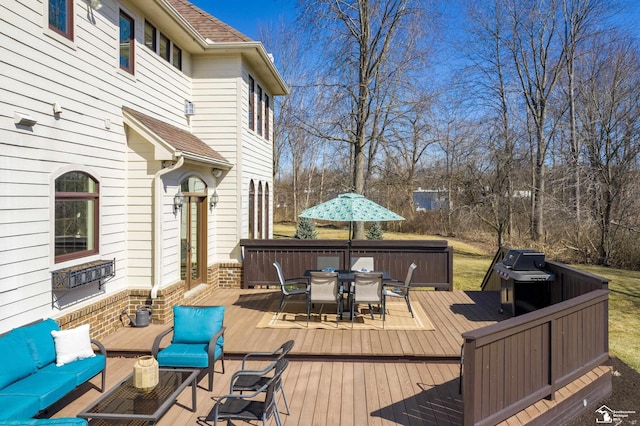 deck featuring an outdoor living space, outdoor dining area, and grilling area