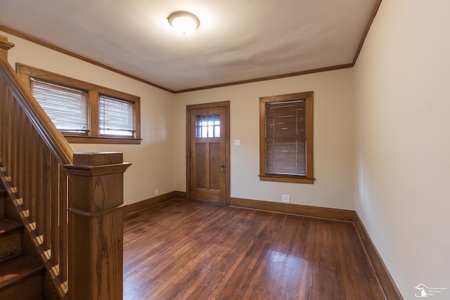 entryway with stairs, baseboards, dark wood finished floors, and crown molding