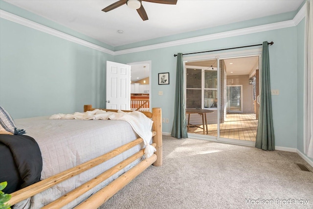 carpeted bedroom with visible vents, ornamental molding, baseboards, and access to outside