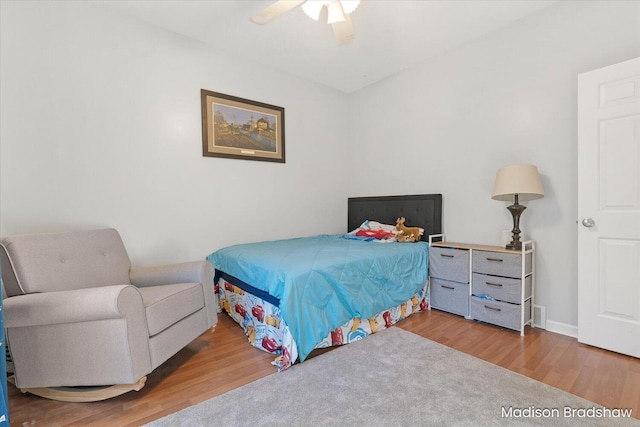 bedroom featuring wood finished floors and ceiling fan