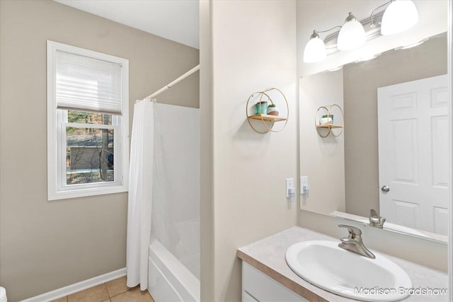 full bathroom with tile patterned floors, baseboards, shower / bath combo, and vanity