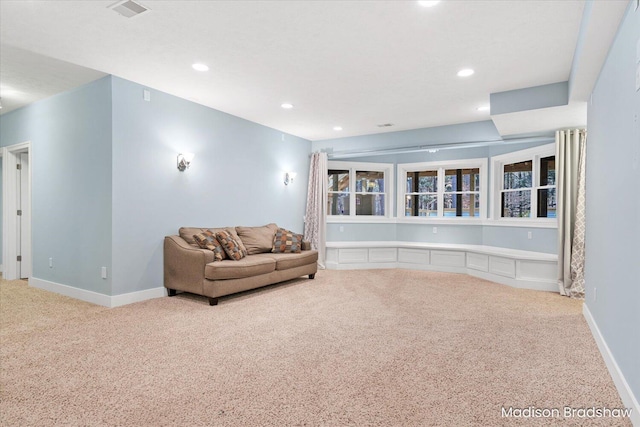 living area featuring visible vents, recessed lighting, baseboards, and carpet