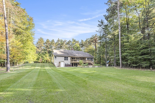 view of yard with a wooden deck