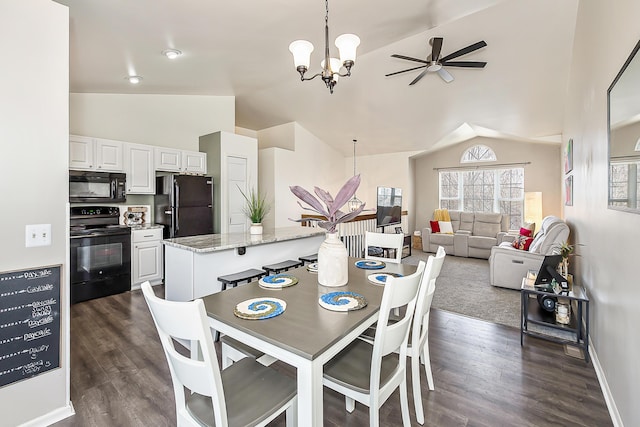 dining space with baseboards, ceiling fan with notable chandelier, dark wood-style flooring, and vaulted ceiling