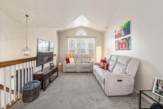 living area featuring an inviting chandelier, lofted ceiling, and carpet