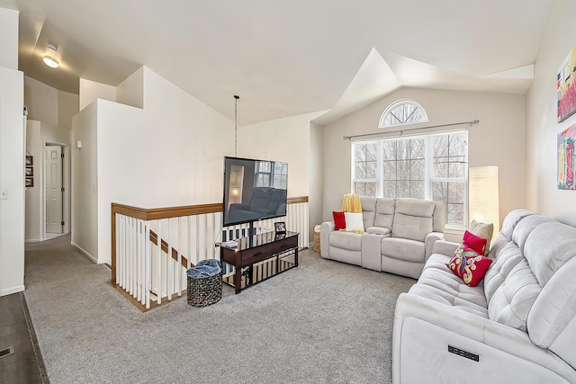 living area with carpet and vaulted ceiling